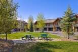 Enjoy the serene beauty of this property, featuring lush green spaces and inviting picnic areas.