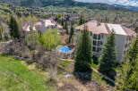 Discover luxury living in this stunning property featuring a beautiful pool and lush landscaping.