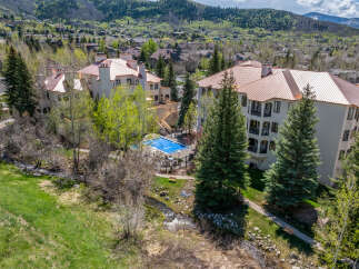 Discover luxury living in this stunning property featuring a beautiful pool and lush landscaping.