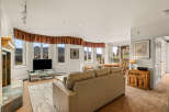 This stunning living room boasts breathtaking mountain views, creating a serene and inviting atmosphere.