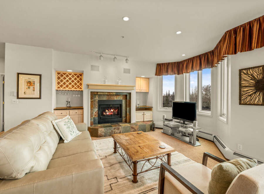This stunning living room features a cozy fireplace, perfect for relaxing evenings.