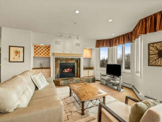 This stunning living room features a cozy fireplace, perfect for relaxing evenings.