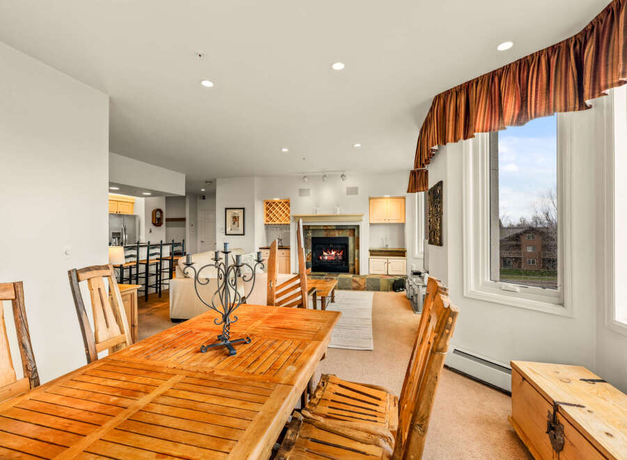 This stunning property boasts a cozy living space with a fireplace, perfect for relaxing evenings.