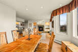 This stunning property boasts a cozy living space with a fireplace, perfect for relaxing evenings.