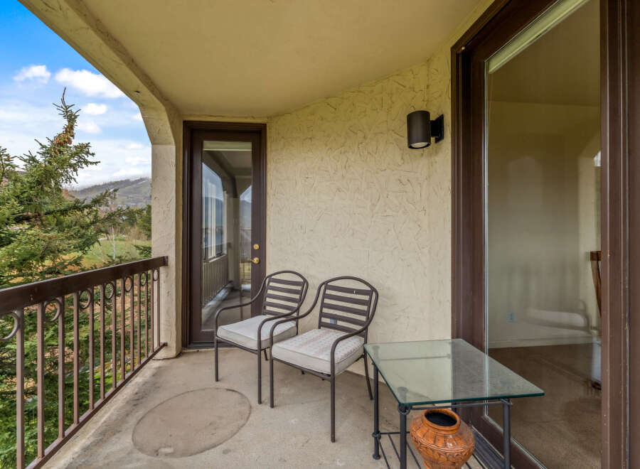 Enjoy the serene views from this charming balcony.