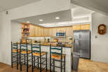 This stunning kitchen boasts a modern design with sleek countertops and ample cabinet space.