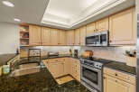 This stunning kitchen boasts elegant cabinetry, offering ample storage and a timeless aesthetic.