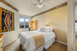 This charming bedroom offers a cozy retreat with its inviting ambiance and stylish decor.