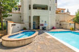Enjoy the ultimate relaxation at this stunning property featuring a luxurious hot tub and a refreshing swimming pool.
