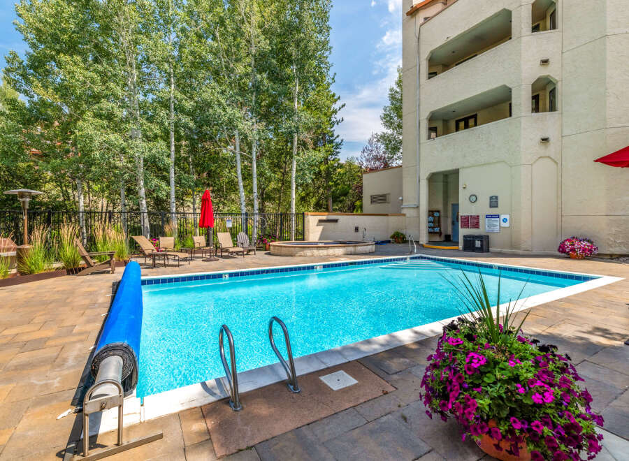 Enjoy a refreshing dip in the sparkling pool, surrounded by lush landscaping and a serene atmosphere.