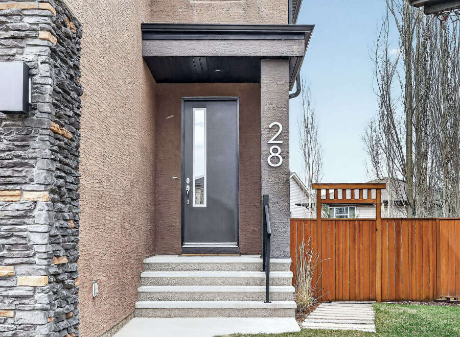 Discover the charm of this stunning property! Featuring a modern facade with a stylish front door and inviting steps, this home exudes curb appeal.