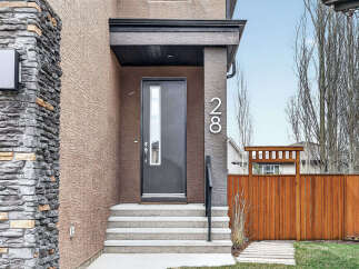 Discover the charm of this stunning property! Featuring a modern facade with a stylish front door and inviting steps, this home exudes curb appeal.