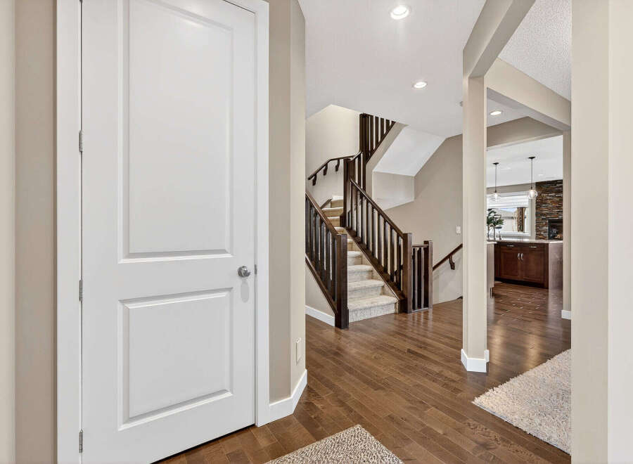 Step into this inviting home and be greeted by a stunning staircase and beautiful hardwood floors.