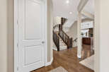Step into this inviting home and be greeted by a stunning staircase and beautiful hardwood floors.
