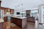 This stunning kitchen and living area boasts a modern design with high-end finishes.