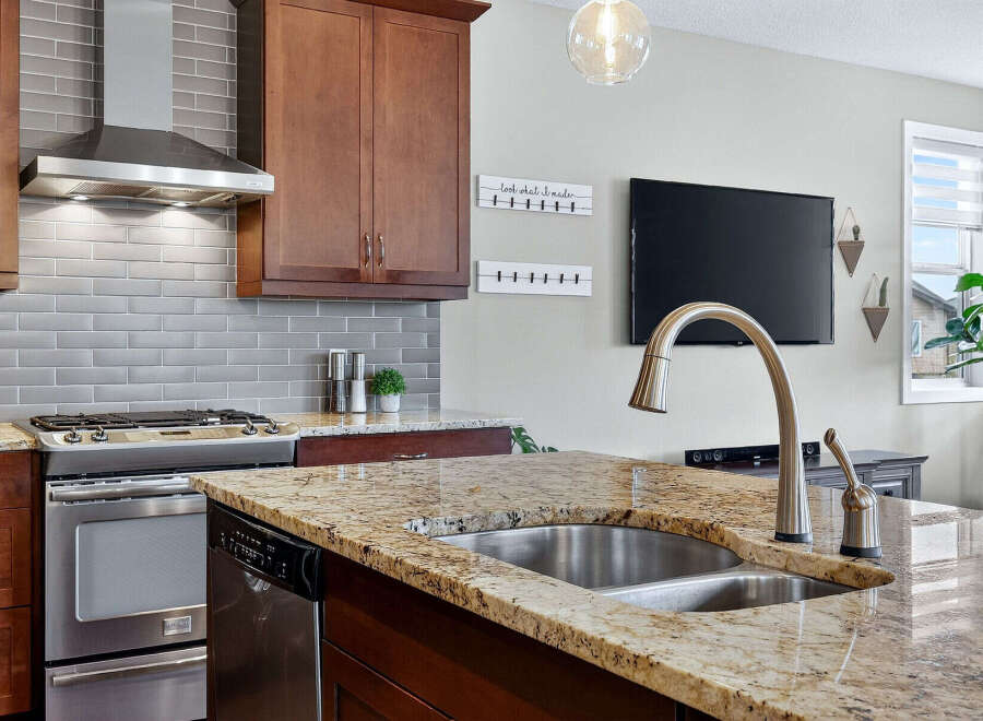This stunning kitchen boasts a modern design with high-end finishes.