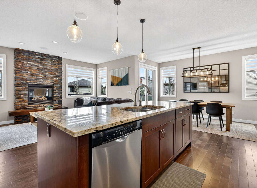 This stunning kitchen boasts a spacious island with a granite countertop, perfect for meal prep and entertaining.