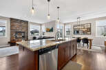 This stunning kitchen boasts a spacious island with a granite countertop, perfect for meal prep and entertaining.
