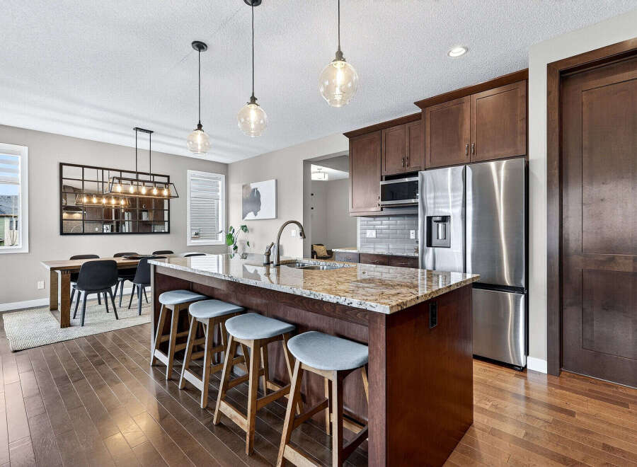 This stunning kitchen boasts a large island with seating, perfect for entertaining.