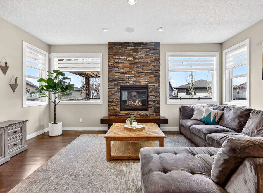 This stunning living room boasts a cozy fireplace, perfect for those chilly evenings.