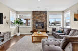 This stunning living room boasts a cozy fireplace, perfect for those chilly evenings.