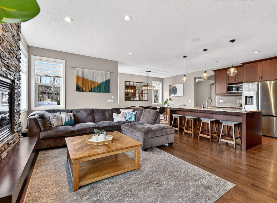 Step into luxury with this stunning property featuring a spacious open-concept living area.