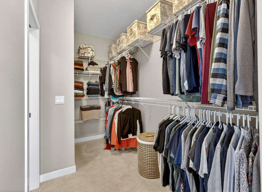 Step into the organized elegance of this walk-in closet, a perfect feature for any home.