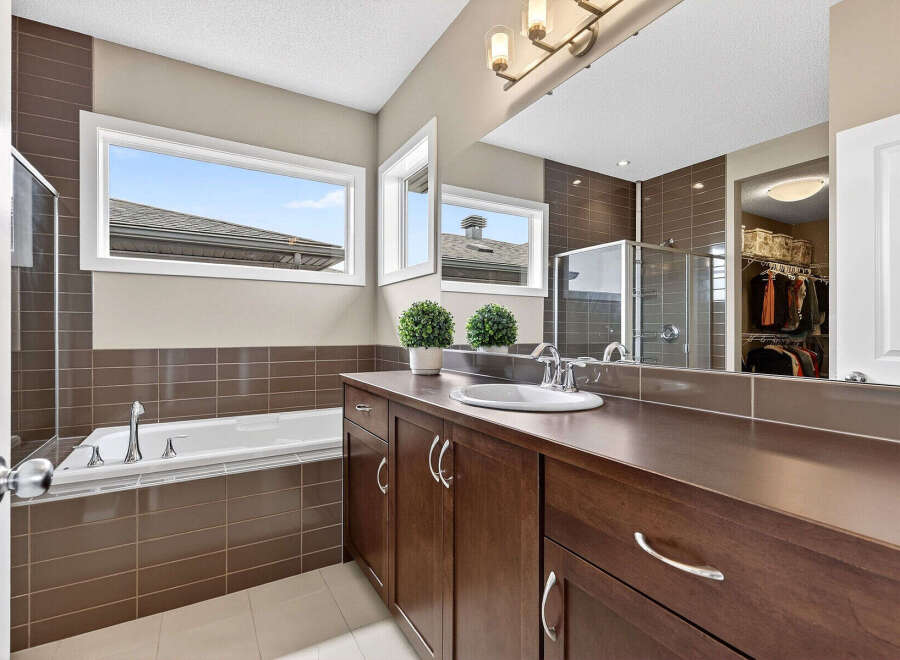 Step into luxury with this stunning bathroom featuring a sleek design and modern amenities.