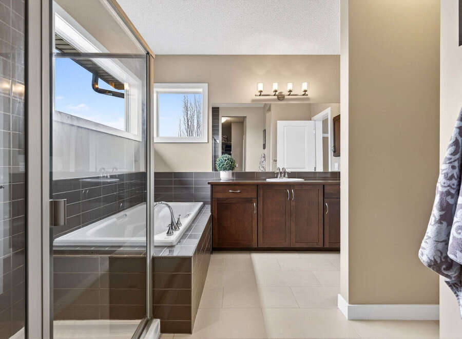 Step into luxury with this stunning bathroom featuring a sleek, modern design.