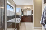 Step into luxury with this stunning bathroom featuring a sleek, modern design.