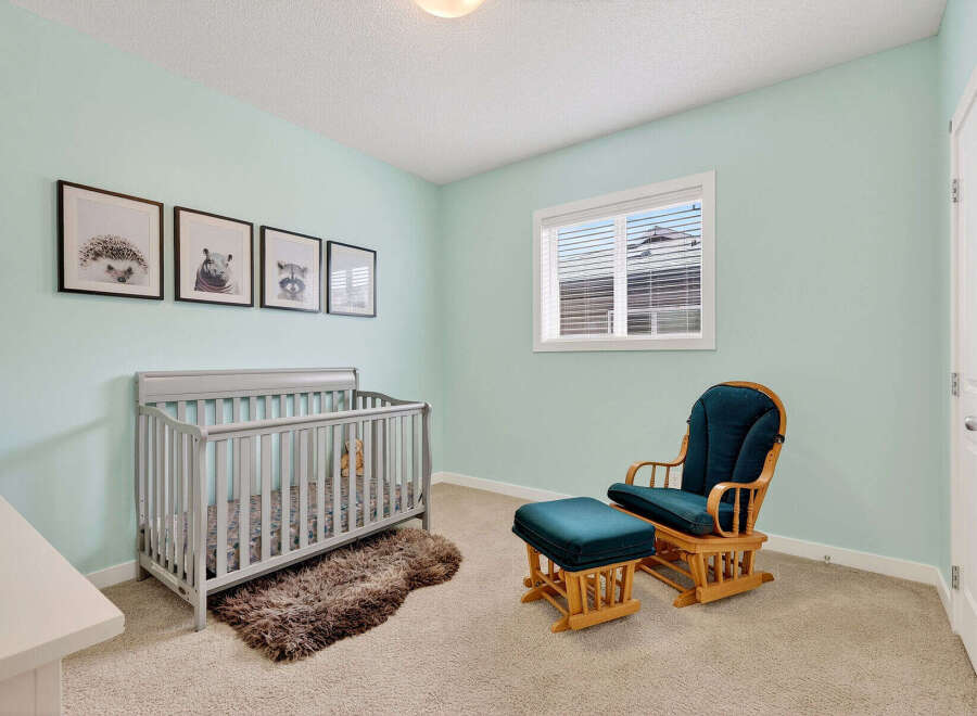 This charming nursery features a cozy crib, perfect for your little one.