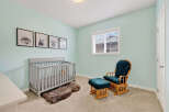 This charming nursery features a cozy crib, perfect for your little one.