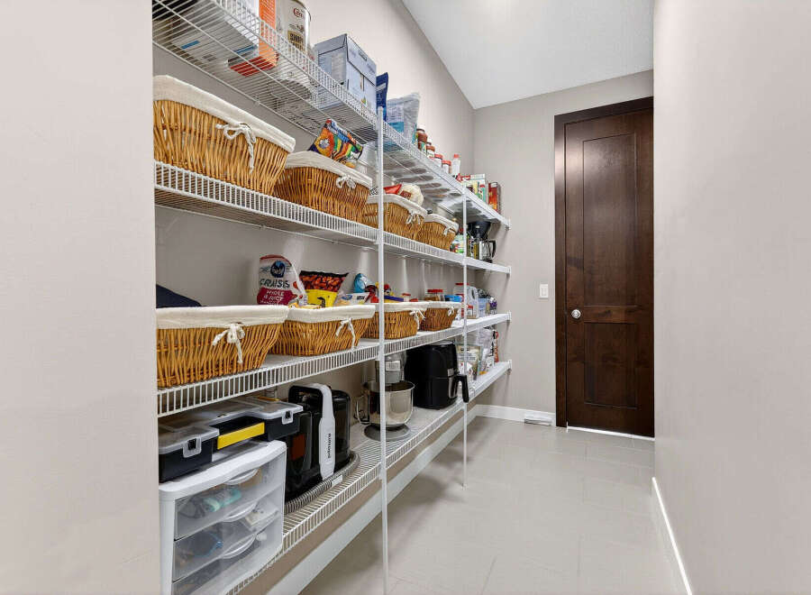 Step into culinary organization with this well-designed pantry.