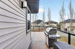 Enjoy outdoor living at its finest with this stunning property featuring a spacious deck and a built-in grill, perfect for entertaining.