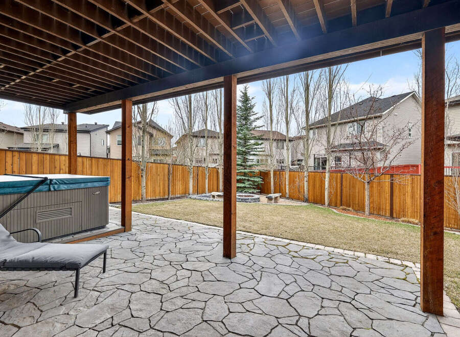 Enjoy outdoor living at its finest with this stunning backyard oasis! Featuring a spacious patio, a relaxing hot tub, and a beautifully landscaped yard, this property is perfect for entertaining or unwinding.