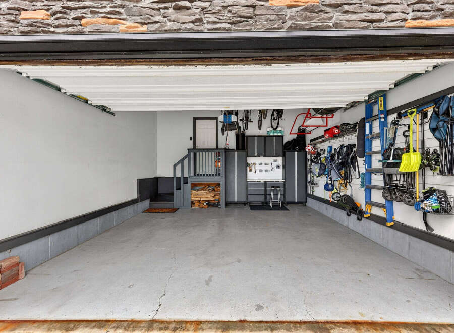 Step into this well-organized garage, perfect for storing vehicles and equipment.