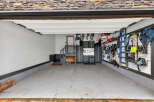 Step into this well-organized garage, perfect for storing vehicles and equipment.