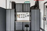 This well-organized garage space features ample storage solutions, including cabinets and drawers, perfect for keeping tools and equipment neatly arranged.