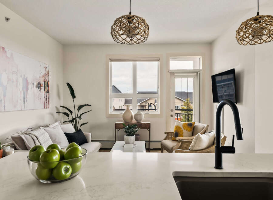 Step into modern elegance with this stunning property! Featuring a bright and airy living space, this home boasts a sleek kitchen with a stylish black faucet and a beautiful countertop.
