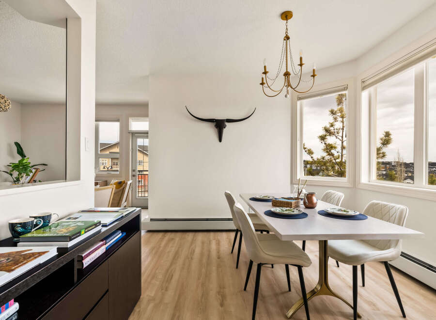 This stunning dining room boasts a modern aesthetic with a touch of rustic charm.