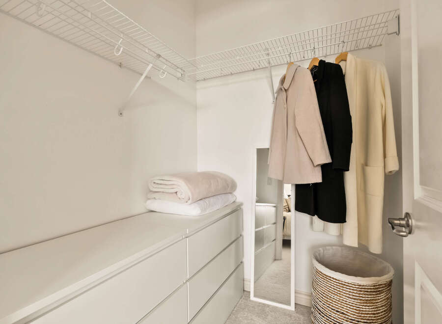 Step into this well-organized closet, perfect for maximizing storage space.