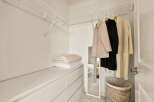 Step into this well-organized closet, perfect for maximizing storage space.
