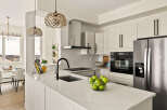 This stunning kitchen boasts modern design and high-end appliances, perfect for culinary enthusiasts.