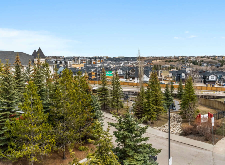 Enjoy stunning views from this beautiful property, showcasing a vibrant neighborhood with modern homes.