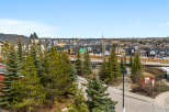 Enjoy stunning views from this beautiful property, showcasing a vibrant neighborhood with modern homes.