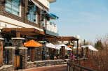 This stunning property boasts a prime location with a vibrant outdoor dining area, perfect for enjoying sunny days.