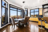 This elegant dining room boasts a stunning view, perfect for hosting memorable gatherings.