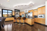 This stunning kitchen boasts a modern design with sleek cabinetry and a spacious layout, perfect for culinary enthusiasts.