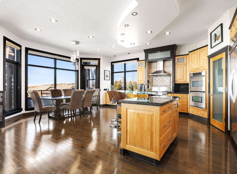 This stunning kitchen boasts a modern design with sleek cabinetry and a spacious island, perfect for culinary enthusiasts.