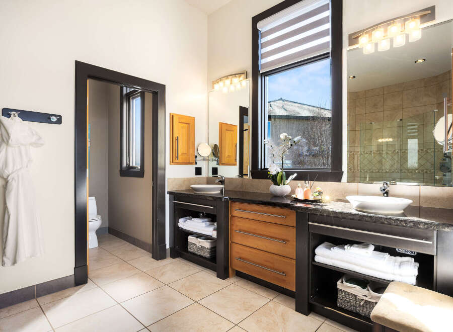 Step into luxury with this stunning bathroom, featuring a sleek design and modern amenities.